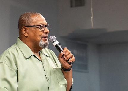 Bishop Alvin T. McNair speaking in microphone
